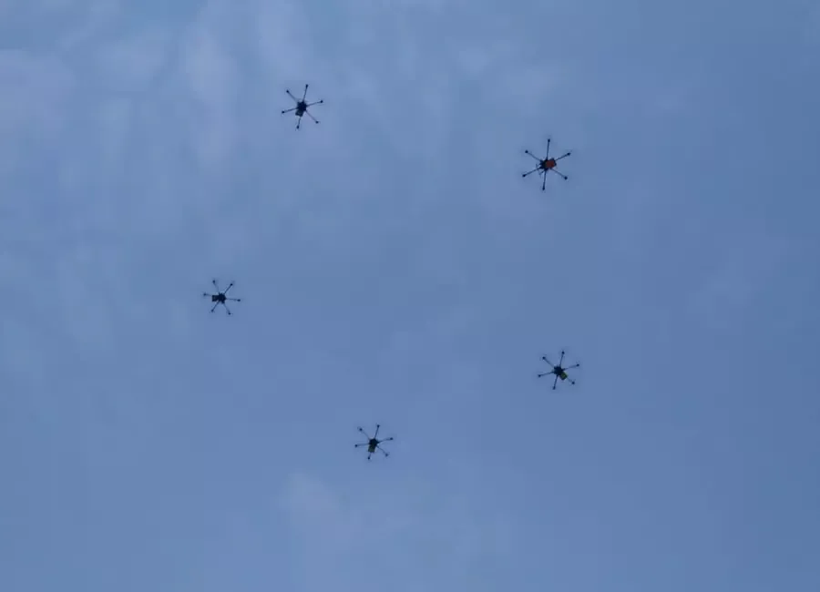 Swarm of five drones forming a pentagon